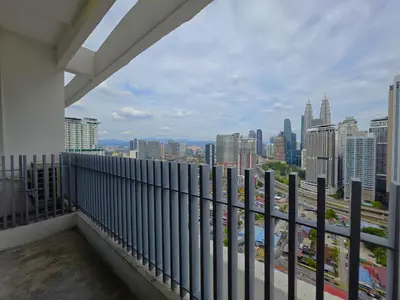 a balcony with a view of a city skyline at The Luxe by Infinitum KLCC by CASABELLESTAY in Kuala Lumpur
