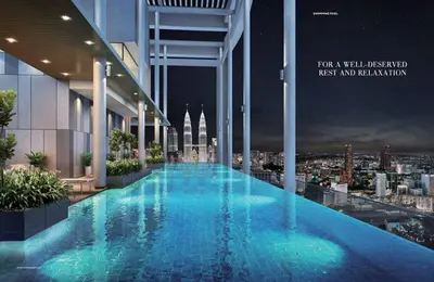 a swimming pool on the roof of a building at The Luxe by Infinitum KLCC by CASABELLESTAY in Kuala Lumpur