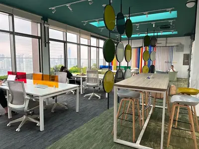 an office with tables and chairs and windows at KL Sentral Monorail Infinity Sky Pool Family Suites -The RIV in Kuala Lumpur