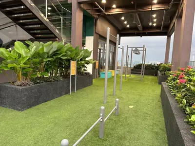 a room with grass and plants in a building at KL Sentral Monorail Infinity Sky Pool Family Suites -The RIV in Kuala Lumpur
