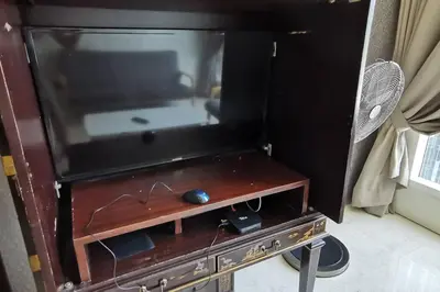 a flat screen tv sitting on top of a table at KL Tower View 3room 2bath 1free parking KLCC in Kuala Lumpur