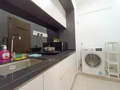 a kitchen with a sink and a washing machine at COL 108A Modern KLCC Balcony View & Infinity Pool in Kuala Lumpur