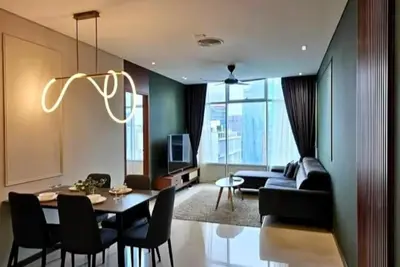 a living room with a dining table and a couch at Premium Living Sky Suites - Twin Towers KLCC 2-min walk in Kuala Lumpur
