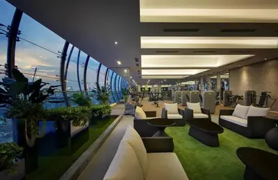 a room with couches and chairs on a cruise ship at Mcity Ampang Duplex Groove in Kuala Lumpur