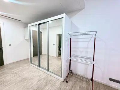 a glass door in a room with a wooden floor at Mcity Ampang Duplex Groove in Kuala Lumpur