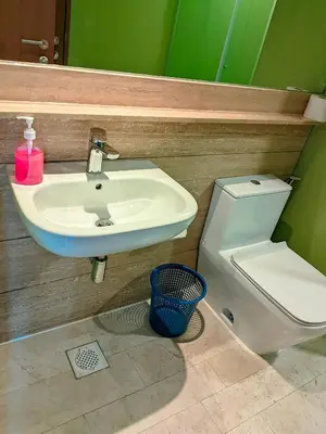 a bathroom with a sink and a toilet at vortex Suites KLCC in Kuala Lumpur