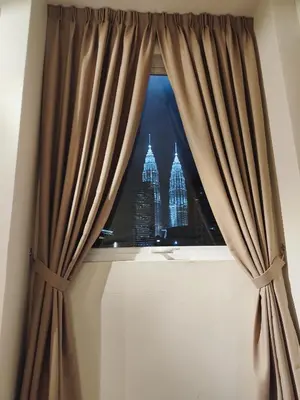 a window with a view of the empire state building at Newly Reno Wisma Cosway Pavilion KLCC Bukit Bintang in Kuala Lumpur