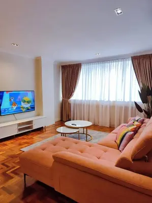 a living room with a couch and a flat screen tv at Newly Reno Wisma Cosway Pavilion KLCC Bukit Bintang in Kuala Lumpur