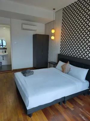 a bedroom with a large white bed in a room at Reizz Residence Majesty Suite in Kuala Lumpur