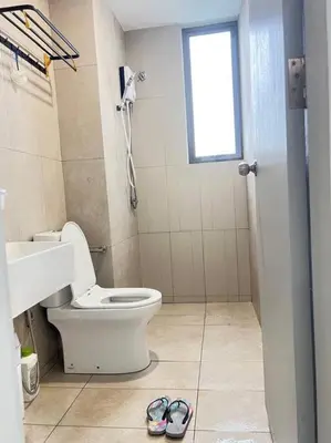a bathroom with a toilet and a sink and a window at Cozy Kenwingston Platz KL 2-5 Pax2BR&2BR Pakin Netflix 1306 in Kuala Lumpur
