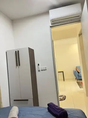 a room with a refrigerator and a room with a couch at Cozy Kenwingston Platz KL 2-5 Pax2BR&2BR Pakin Netflix 1306 in Kuala Lumpur