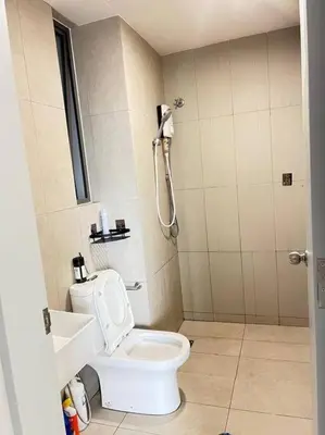 a bathroom with a white toilet and a shower at Cozy Kenwingston Platz KL 2-5 Pax2BR&2BR Pakin Netflix 1306 in Kuala Lumpur