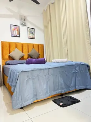 a bedroom with a bed with blue sheets and pillows at Cozy Kenwingston Platz KL 2-5 Pax2BR&2BR Pakin Netflix 1306 in Kuala Lumpur