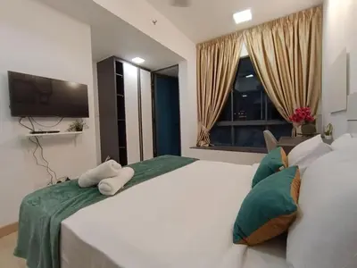 a bedroom with two white beds and a flat screen tv at COL 171B KLCC Balcony View & Infinity Pool in Kuala Lumpur