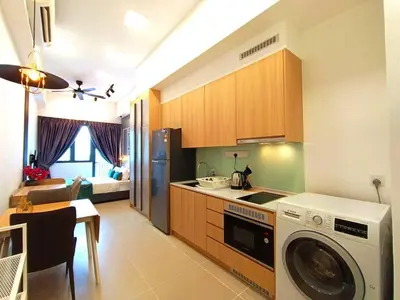 a kitchen with a washing machine in a kitchen at COL 23a8A Morden KLCC View Studio in Kuala Lumpur