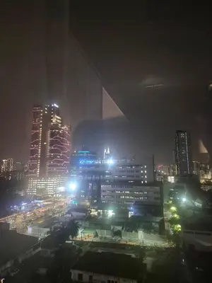 a city lit up at night with buildings at 3 Towers Jalan Ampang KL in Kuala Lumpur