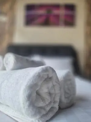 a close up of a towel on a bed at 3 Towers Jalan Ampang KL in Kuala Lumpur