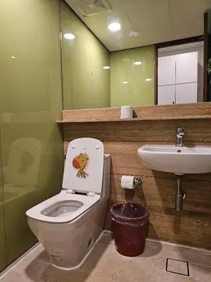 a bathroom with a toilet and a sink at The Sky Residence KLCC by AsianHost in Kuala Lumpur