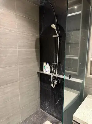 a shower in a bathroom with a glass door at Expressionz Professional Suites Studio in Kuala Lumpur