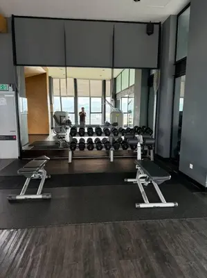 a gym with two treadmills and a mirror at Expressionz Professional Suites Studio in Kuala Lumpur