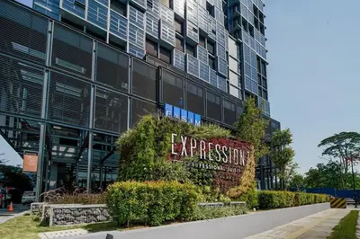a large building with a sign in front of it at Expressionz Professional Suites Studio in Kuala Lumpur