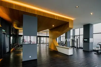 a large room with wooden floors and glass windows at Expressionz Professional Suites Studio in Kuala Lumpur