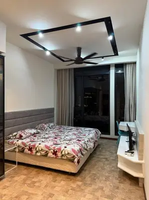 a bedroom with a bed and a ceiling fan at Expressionz Professional Suites Studio in Kuala Lumpur