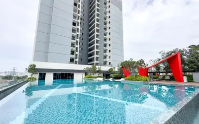 a large swimming pool in front of a building at Vista Sentul Residences by Airhost in Kuala Lumpur