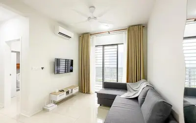 a living room with a couch and a tv at Vista Sentul Residences by Airhost in Kuala Lumpur