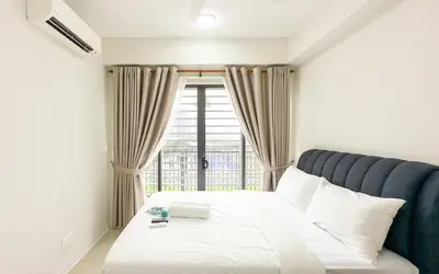 a bedroom with a bed and a window at Vista Sentul Residences by Airhost in Kuala Lumpur