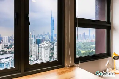 a room with two windows with a view of a city at Skypool with KLCC View - KL Sentral Riveria City Suite Near KL City Centre KLCC in Kuala Lumpur