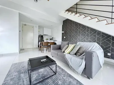 a living room with a couch and a table at Arte Mont Kiara Wonder 2BR Suites in Kuala Lumpur