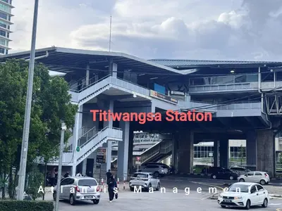 a tivangaea station with cars parked in a parking lot at Kuala Lumpur, KLCC View, Titiwangsa, Tr Resident,Near MRT Station, 3BR 2BH by Atlantis Management in Kuala Lumpur