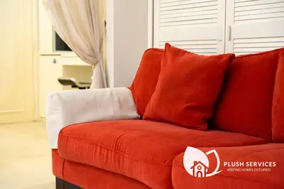 a red couch sitting in a living room at Parkview KLCC, Bukit Bintang in Kuala Lumpur