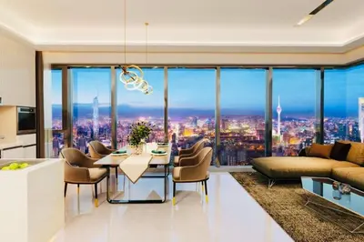 a living room with a view of a city at CORE TRX Suites in Kuala Lumpur