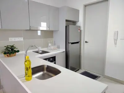 a kitchen with a sink and a yellow bottle on the counter at Trion Residence Kuala Lumpur by Luxe in Kuala Lumpur