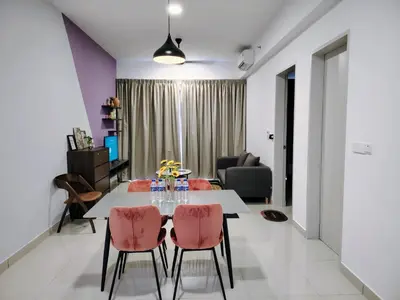 a dining room and living room with a table and chairs at Trion Residence Kuala Lumpur by Luxe in Kuala Lumpur