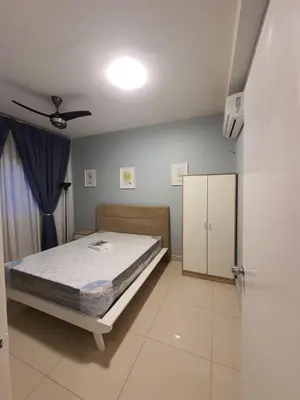 a bedroom with a bed and a cabinet at Maxim Citylights Sentul in Kuala Lumpur