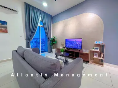 a living room with a couch and a tv at TR Residence Cozy & Luxury Apartment, Walking Distance MRT Titiwangsa & Nearby Titiwangsa Lake Garden in Kuala Lumpur