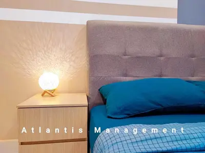 a bedroom with a bed and a lamp on a night stand at TR Residence Cozy & Luxury Apartment, Walking Distance MRT Titiwangsa & Nearby Titiwangsa Lake Garden in Kuala Lumpur