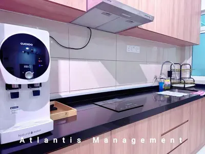 a kitchen with an atantis management machine on the counter at TR Residence Cozy & Luxury Apartment, Walking Distance MRT Titiwangsa & Nearby Titiwangsa Lake Garden in Kuala Lumpur