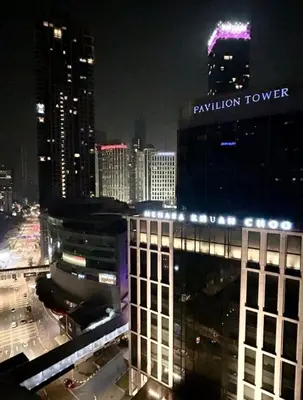 a view of a city skyline at night at 1Min Pavilion Bukit Bintang KLCC Wisma Cosway in Kuala Lumpur