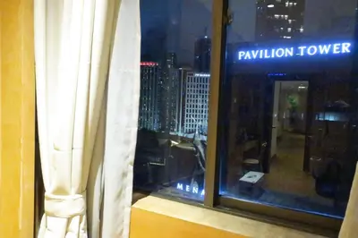 a window with a view of a city skyline at 1Min Pavilion Bukit Bintang KLCC Wisma Cosway in Kuala Lumpur