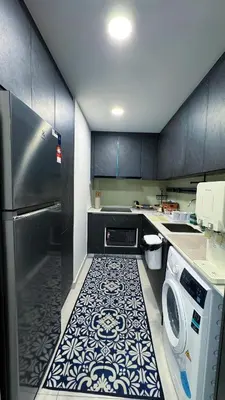 a kitchen with a refrigerator and a washer and dryer at The Atrium Ampang KLCC City , 55000Jalan Ampang Hilir, Taman U Thant KLCC in Kuala Lumpur
