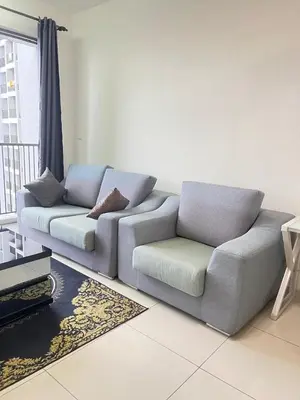 a couch and a chair in a living room at Cozy Kenwingston Platz KL 2-5 Pax2BR&2BR PakinNetf 4305A in Kuala Lumpur