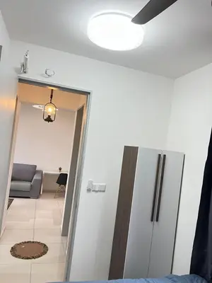 a room with a refrigerator and a living room at Cozy Kenwingston Platz KL 2-5 Pax2BR&2BR PakinNetf 4305A in Kuala Lumpur