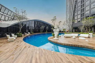 a swimming pool in the middle of a building at Gaming World Suite In Arte Mont Kiara in Kuala Lumpur