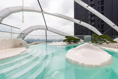 a swimming pool with snow on the floor of a building at Gaming World Suite In Arte Mont Kiara in Kuala Lumpur