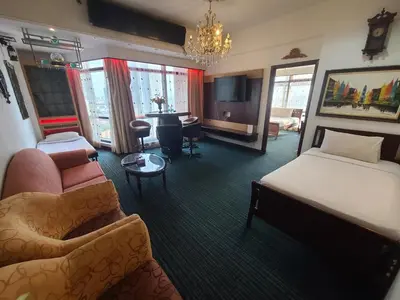 a hotel room with a bed and a living room at KL BRB sarvice suite at time square in Kuala Lumpur