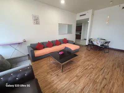 a living room with a couch and a table at KL BRB sarvice suite at time square in Kuala Lumpur
